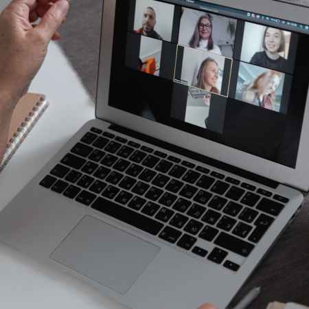 a group of people chatting in a video call in a laptop